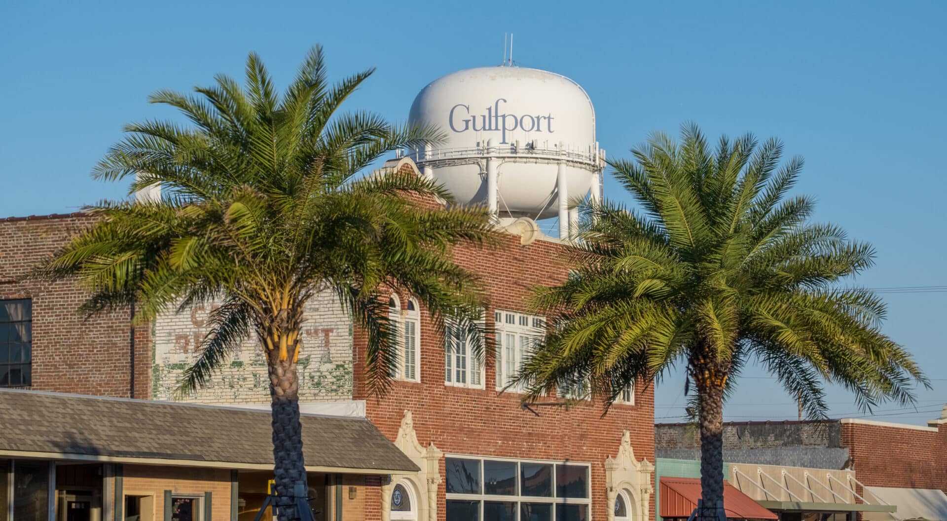 Gulfport Mississippi Gulfport Mississippi water tower behind brick building.