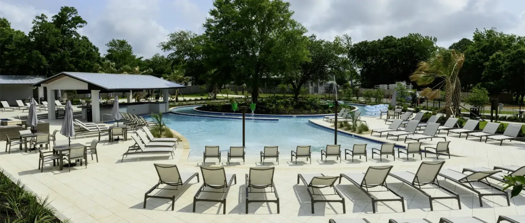 Full pool view with lazy river attached.