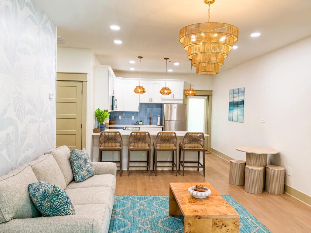 Spacious kitchen and living room in cottage rental at gulfport luxury rv resort.
