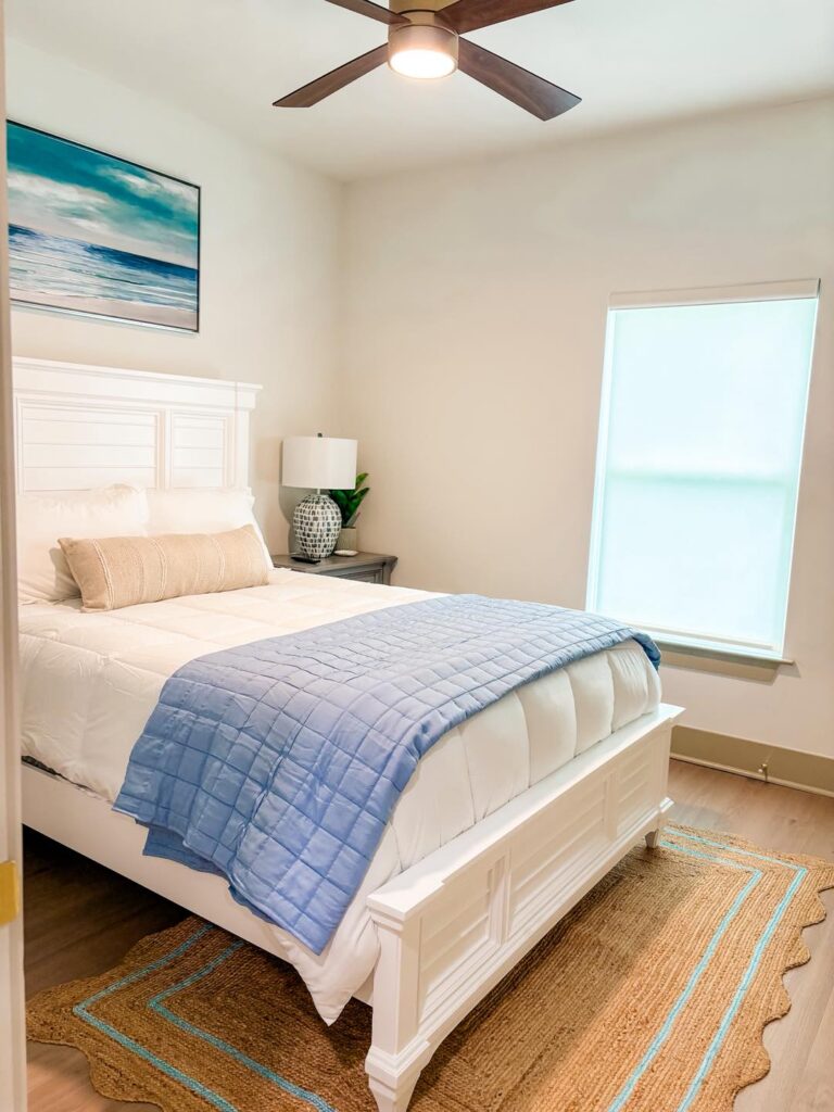 Guest room with bed in cottage rental.